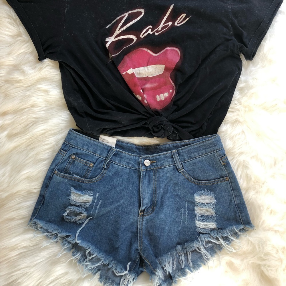 Distressed blue jean shorts